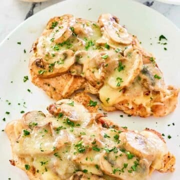 Copycat Texas Roadhouse smothered chicken on a plate.