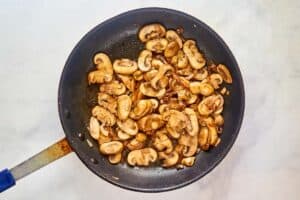 Sauteed mushrooms in a skillet.