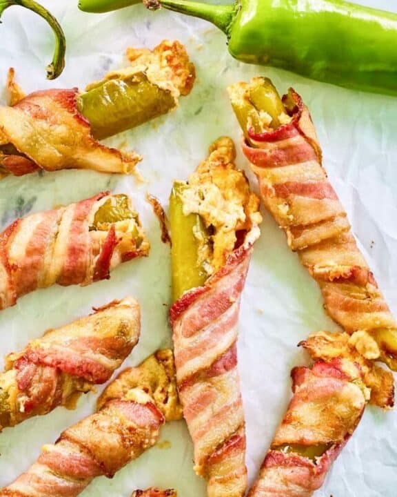Stuffed hatch chile peppers wrapped in bacon.