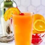 Copycat Applebee's Bahama Mama drink garnished with an orange slice and cherry.