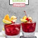 Homemade Applebee's red apple sangria in two lowball glasses.