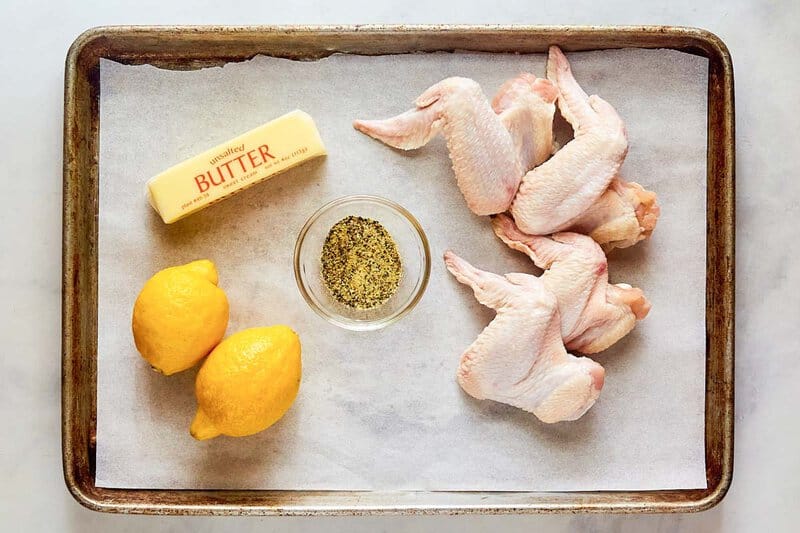Copycat Buffalo Wild Wings lemon pepper wings ingredients on a tray.