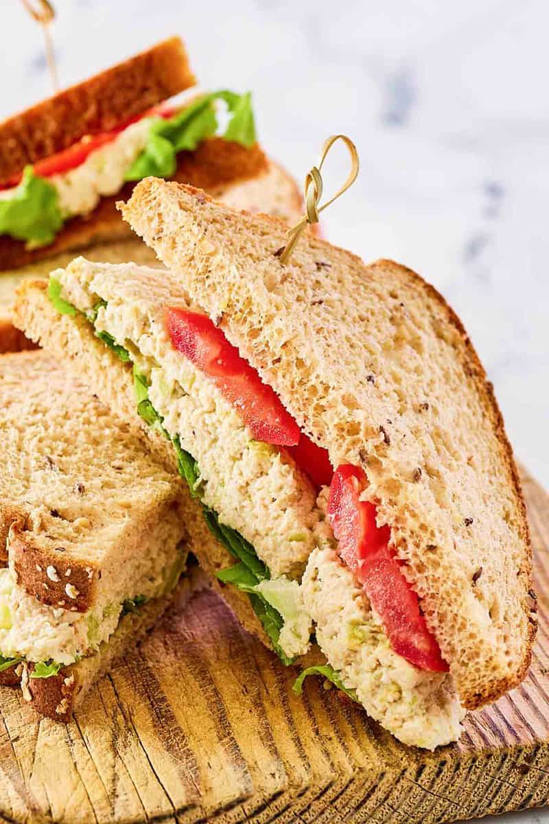 Copycat Chick Fil A chicken salad sandwich with lettuce and tomato.