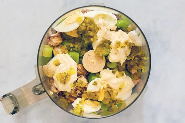 Copycat Chick Fil A chicken salad ingredients in a food processor.