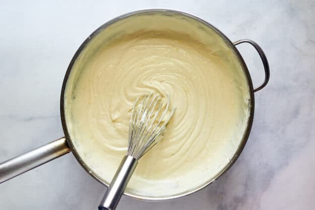 Finished white wine sauce in a pan.