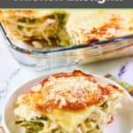 Chicken lasagna with white wine sauce and asparagus on a plate.