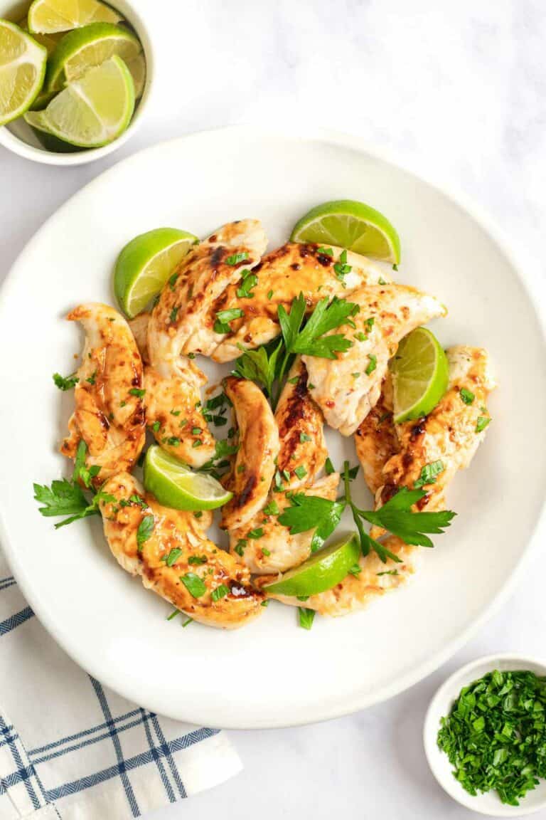 Overhead view of copycat Cracker Barrel grilled chicken tenders on a plate.
