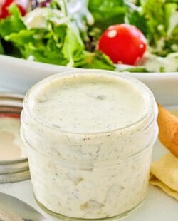 A jar of homemade dill pickle ranch dressing.