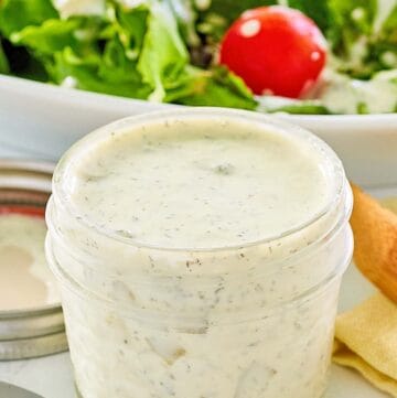 A jar of homemade dill pickle ranch dressing.