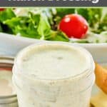 Dill pickle ranch dressing in a jar in front of a salad.