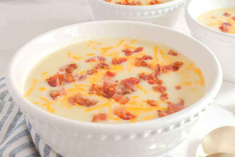 Copycat La Madeleine country potato soup topped with bacon and cheese.