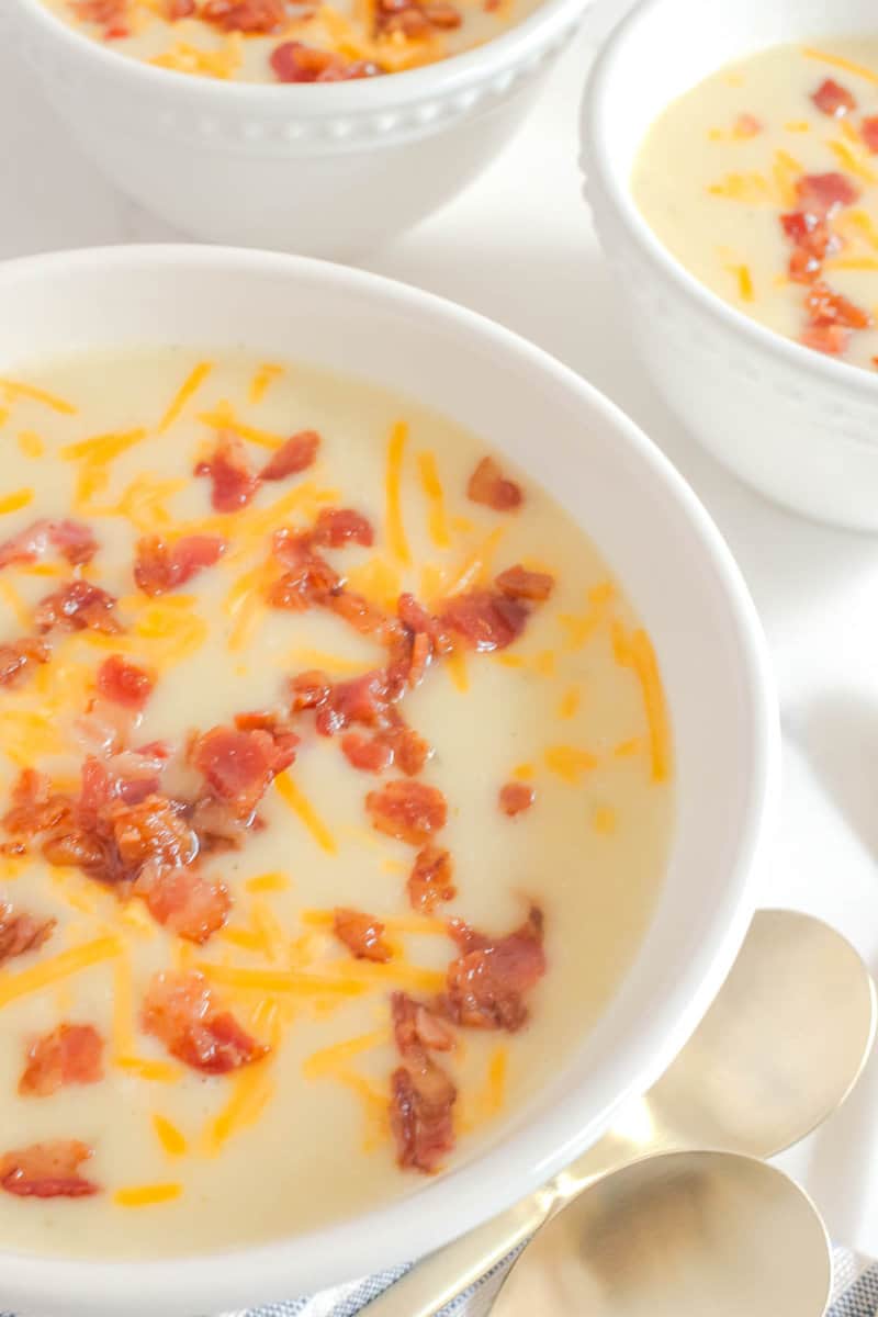 Copycat La Madeline country potato soup in white bowls.