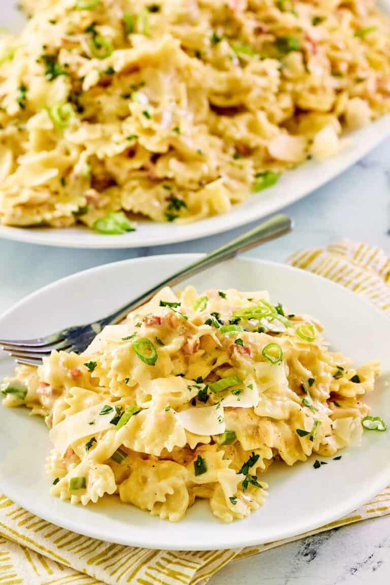 Copycat Macaroni Grill sugo bianco on a plate and a platter.