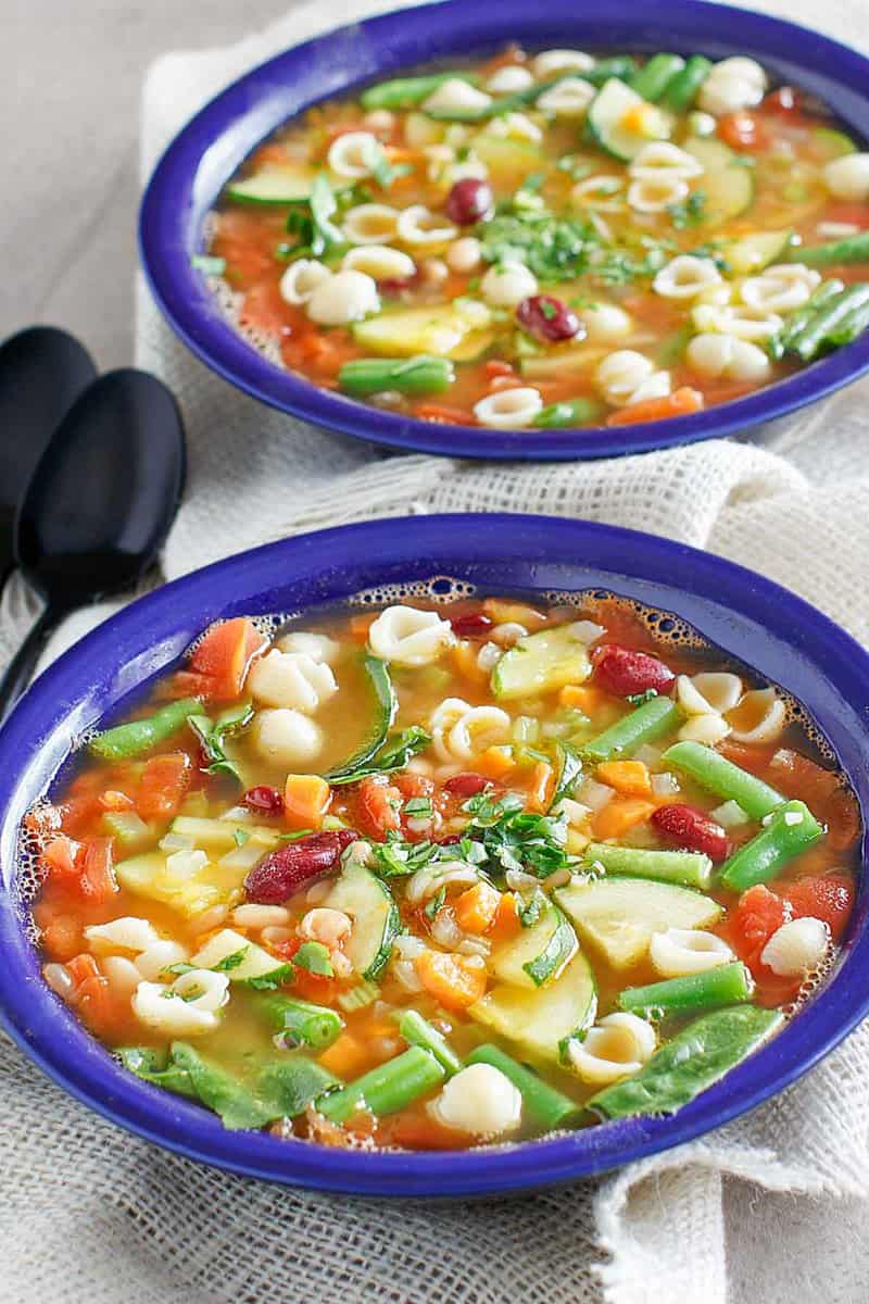 Copycat Olive Garden minestrone soup in two bowls.