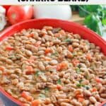 Copycat Pappasito's charro beans in an oval serving dish.
