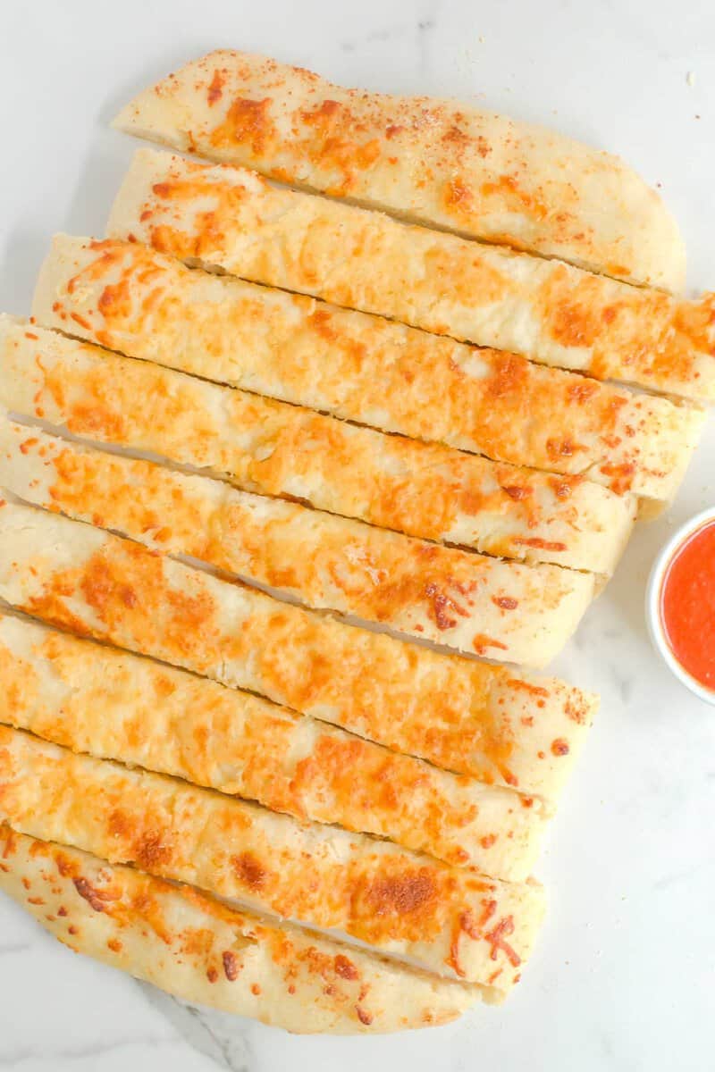 Overhead view of copycat Pizza Hut cheese sticks on a marble surface.