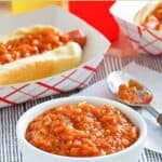 Copycat Sabrett onion sauce in a bowl and on a hot dog.
