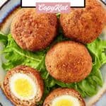 Overhead view of Scotch eggs on a plate.