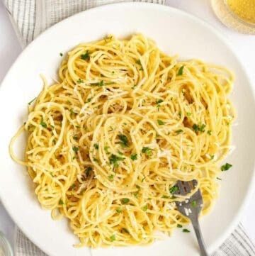 Overhead view of copycat Old Spaghetti Factory spaghetti with mizithra cheese and browned butter.