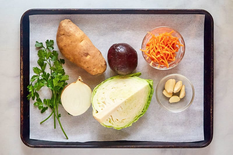 Borscht ingredients on a tray.