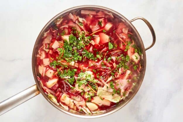 Borscht cooking in a large pot.