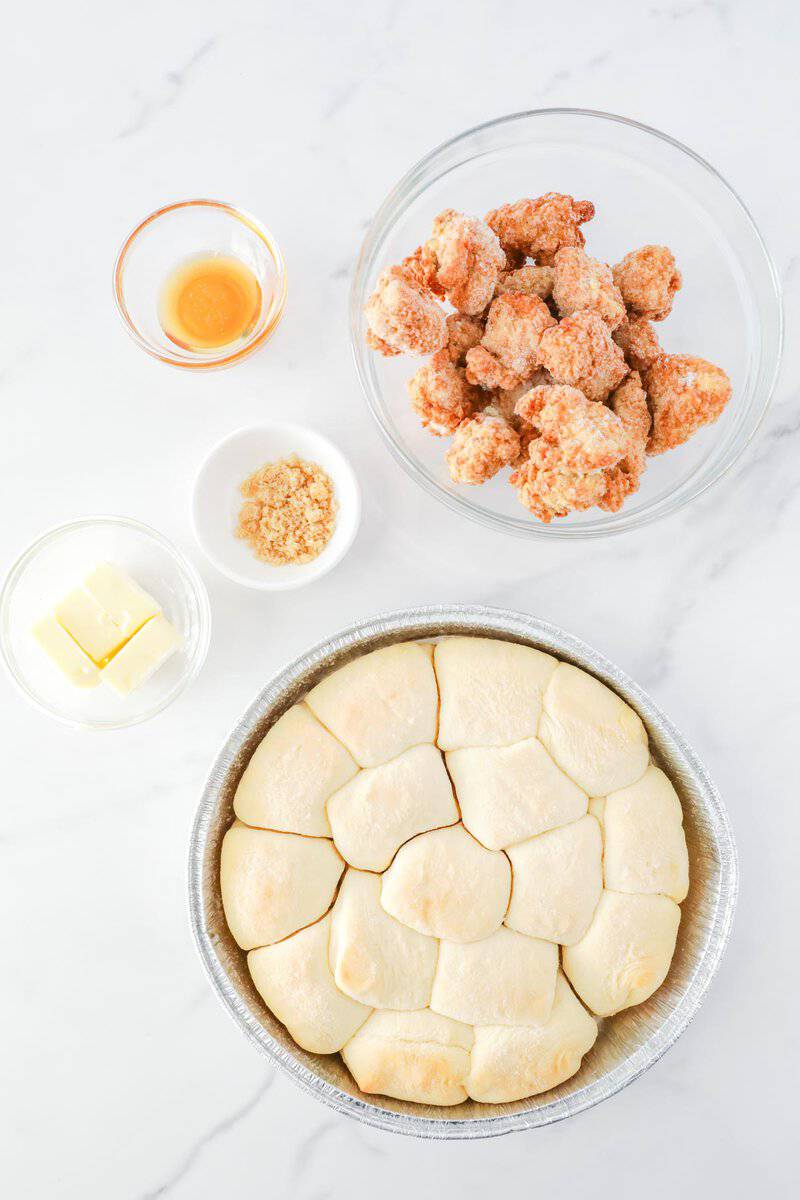 Copycat Chick Fil A chicken minis ingredients on a marble surface.