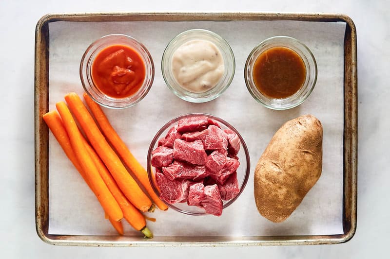 Crockpot beef stew ingredients on a tray.