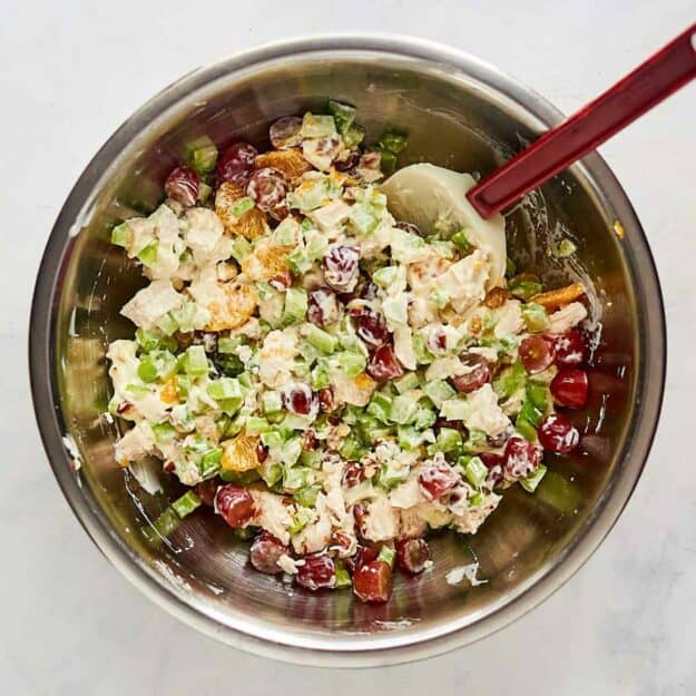 Fruity chicken salad in a mixing bowl.