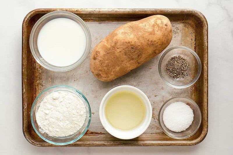Jojo potato wedges ingredients on a tray.