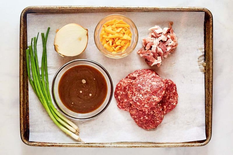 Copycat Luby's sausage steak ingredients on a tray.