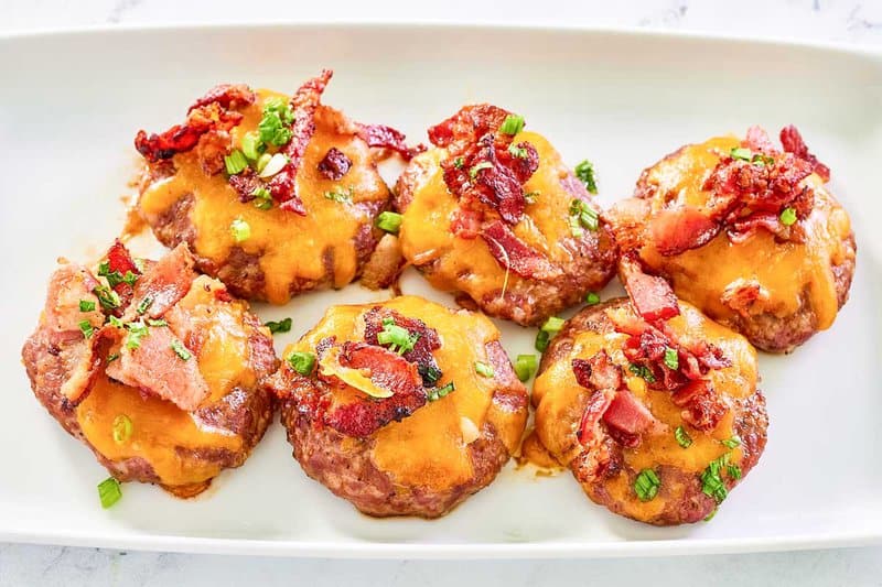 Copycat Luby's sausage steak patties on a rectangular platter.