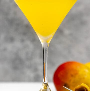 Copycat Olive Garden mango martini and a mango.