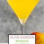 Homemade Olive Garden mango martini on a coaster.
