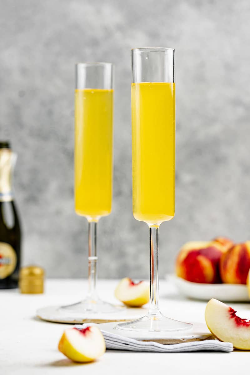 Copycat Olive Garden peach bellini in two glasses.