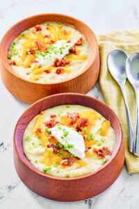 Copycat Panera baked potato soup in two bowls.