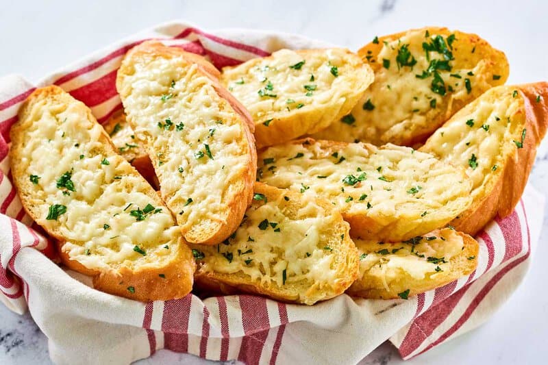 Copycat Pasta House garlic cheese bread slices in a basket.