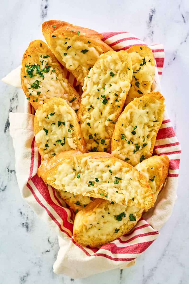 Copycat Pasta House Company garlic cheese bread in a basket.