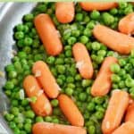 Cooked buttery peas and carrots.