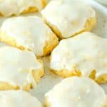 Iced pineapple cookies on a plate.