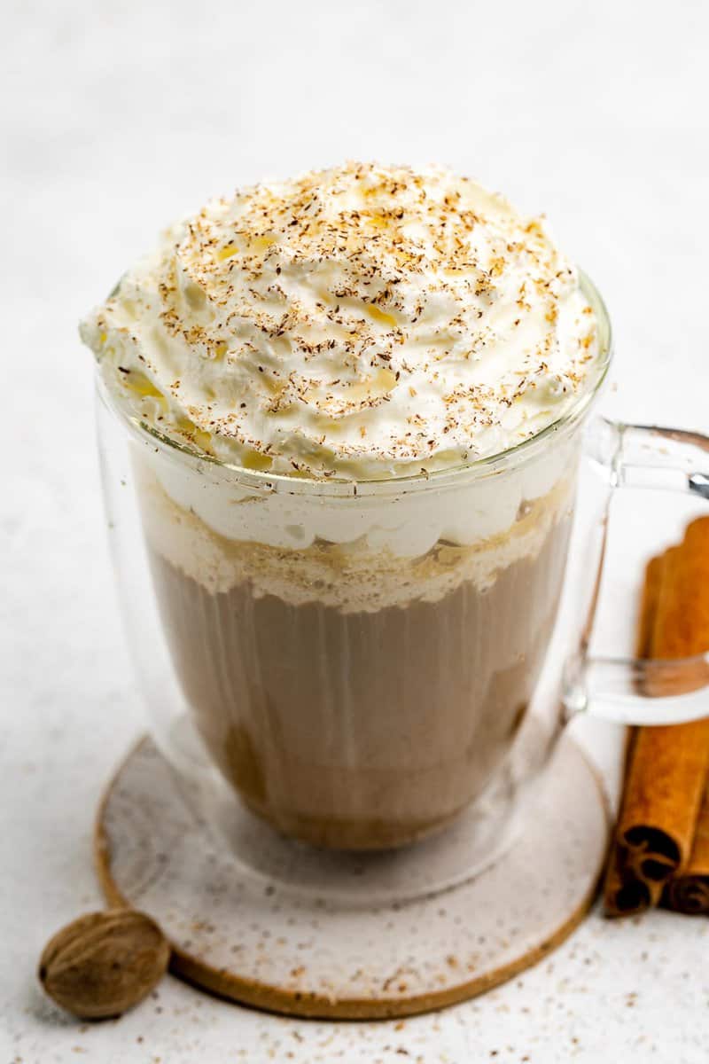 Copycat Starbucks pumpkin spice latte topped with whipped cram.
