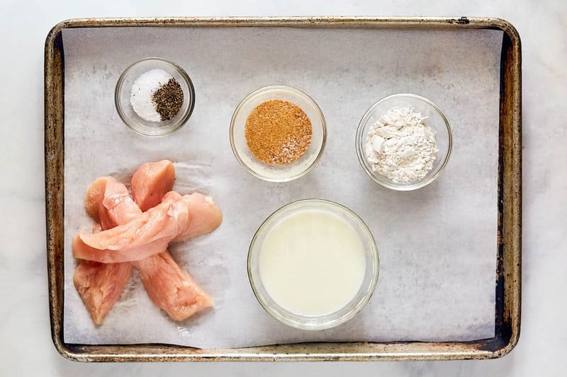 Copycat Whataburger chicken strips ingredients on a tray.