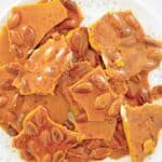 Almond brittle candy piled on a plate.