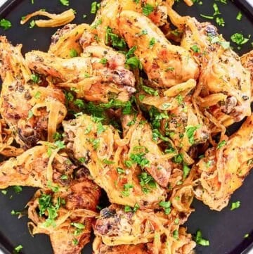 Copycat Anthony's coal fired wings on a large plate.