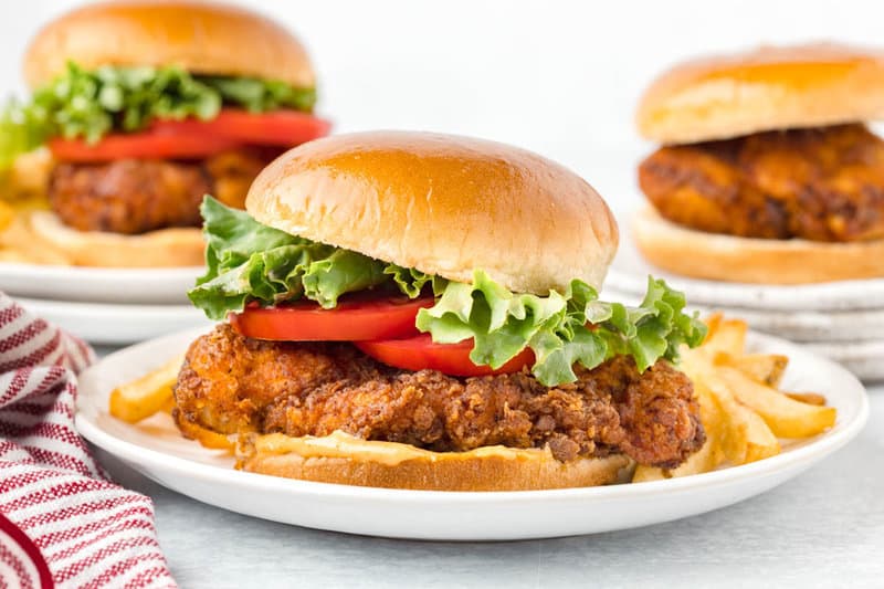 Copycat Burger King BK royal chicken sandwiches on plates.