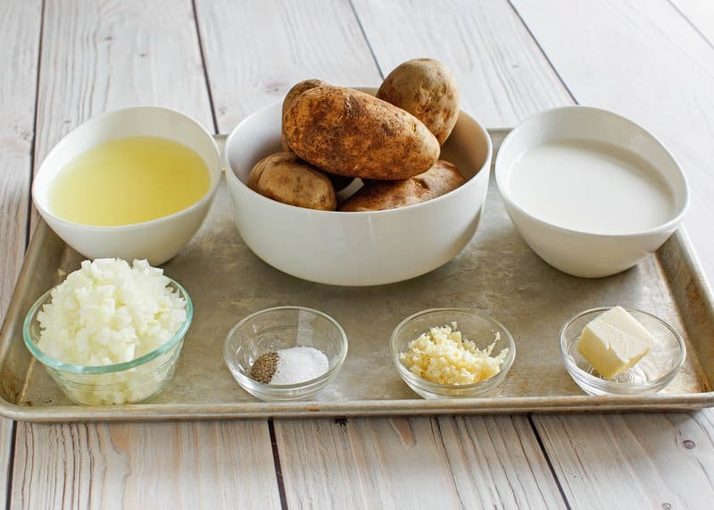 Copycat Bennigan's ultimate baked potato soup ingredients on a tray.