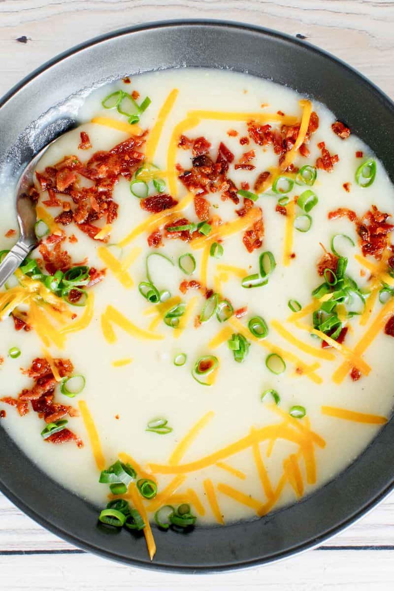 Copycat Bennigan's ultimate baked potato soup in a bowl.