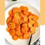 Boiled sliced carrots on a plate.