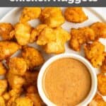 Homemade Chick Fil A chicken nuggets and sauce on a plate.