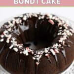 Chocolate peppermint bundt cake with mint ganache and crushed candies on top.