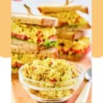 Curried chicken salad in a small bowl and in sandwiches.